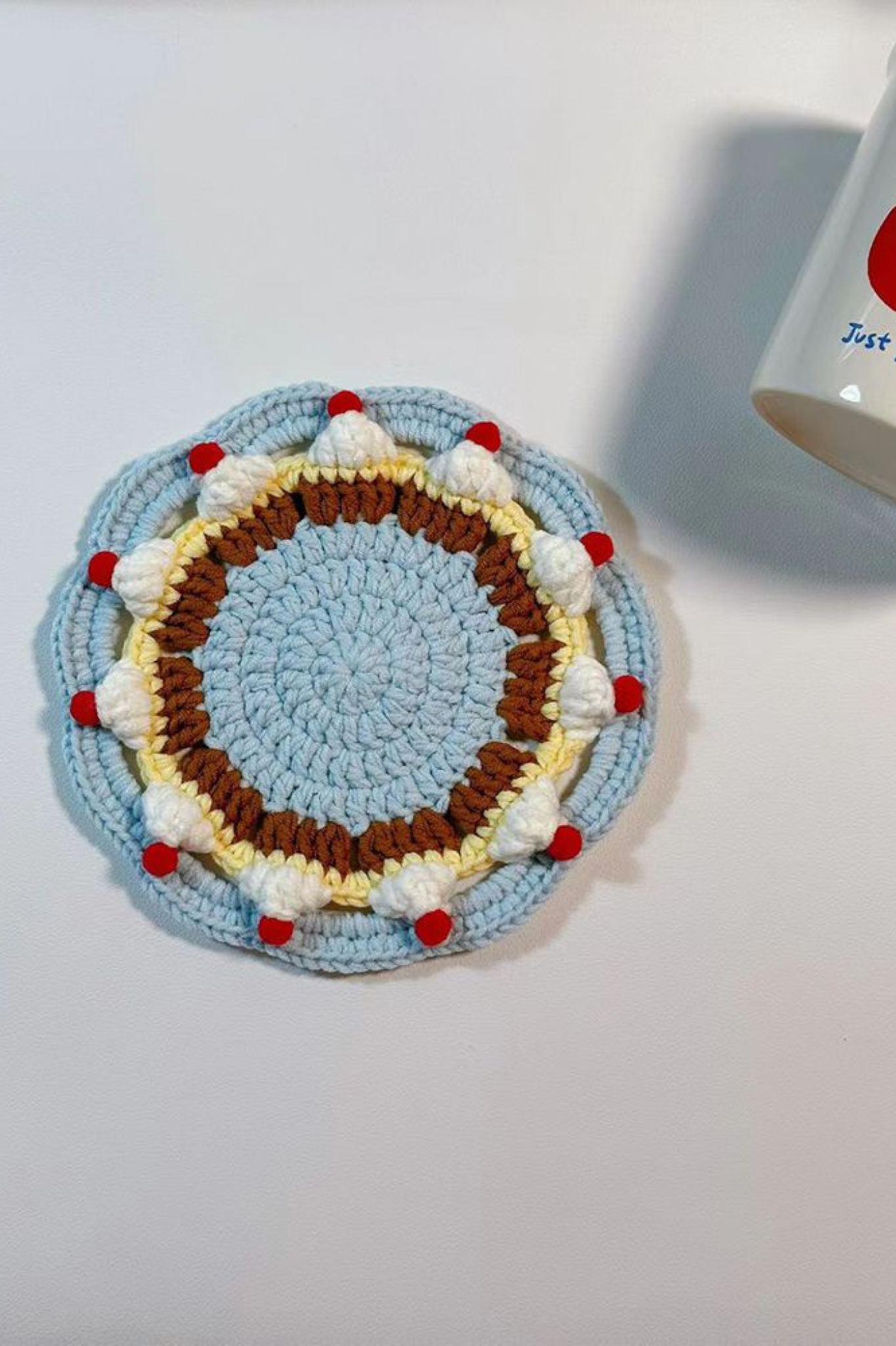 Handmade Finished Hand-crocheted coasters - vibrant red and blue cake color scheme