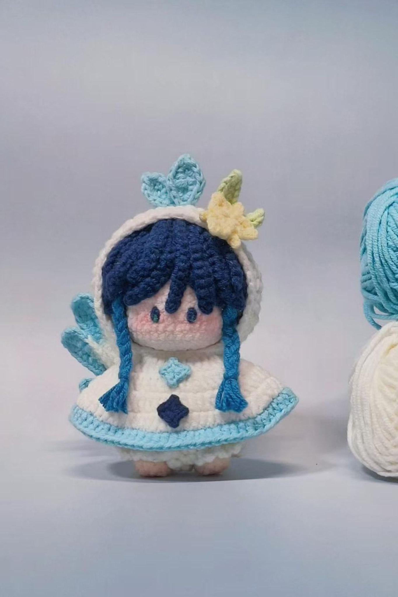 Close-up of yarn and accessories in Venti amigurumi crochet kit — handmade material pack