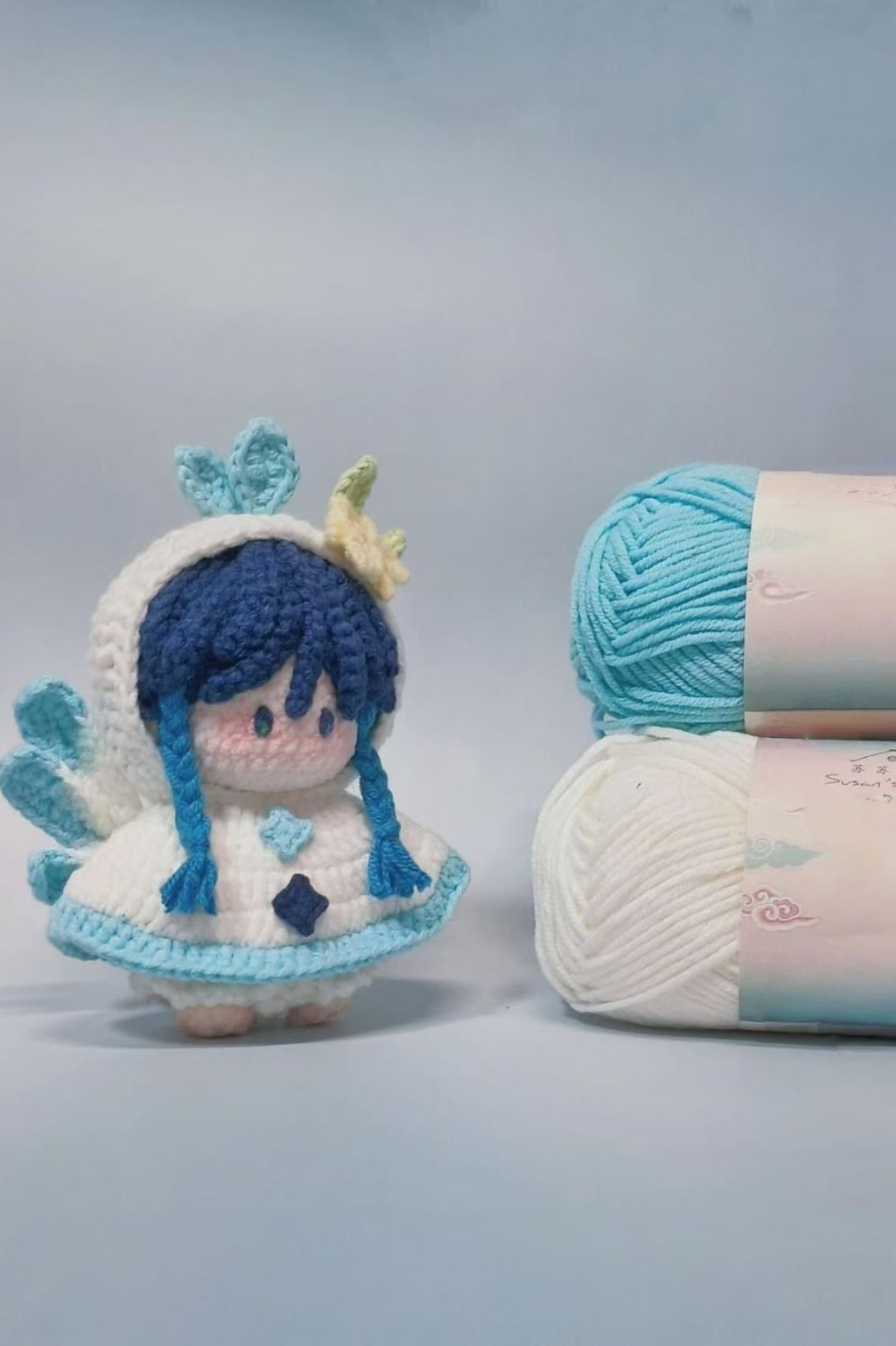 Close-up of yarn and accessories in Venti amigurumi crochet kit — handmade material pack